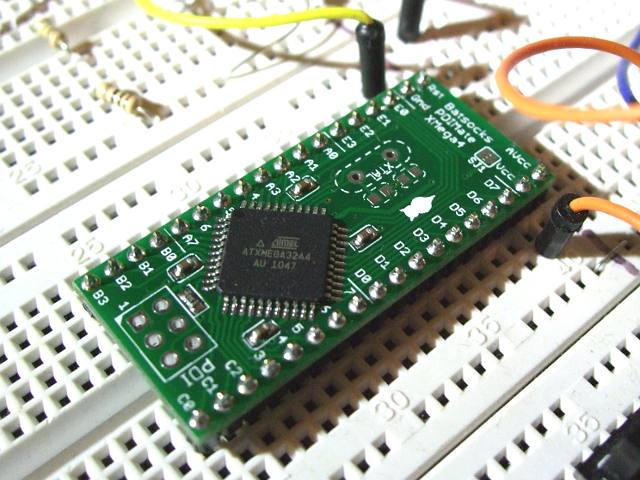 An earlier revision of XMega PDI board in use on a prototyping breadboard.